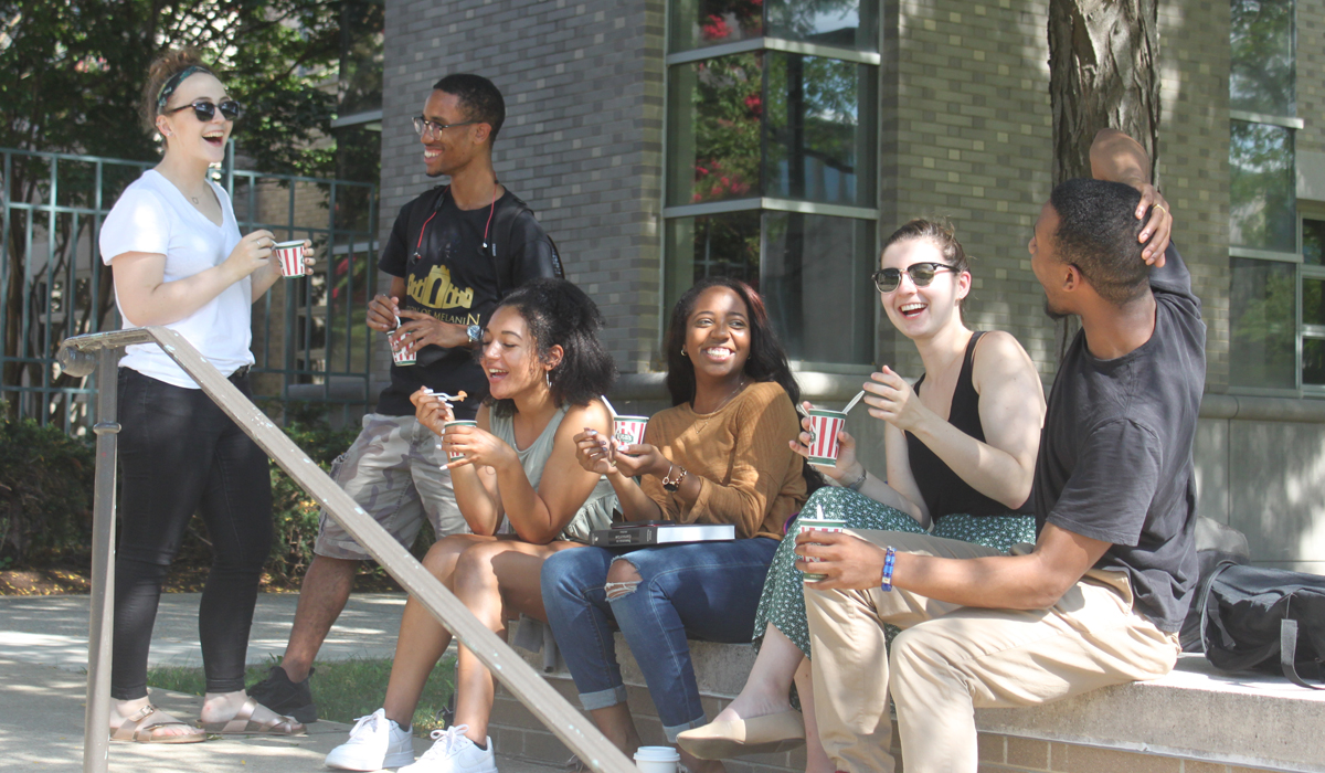 students relaxing outside of the law school