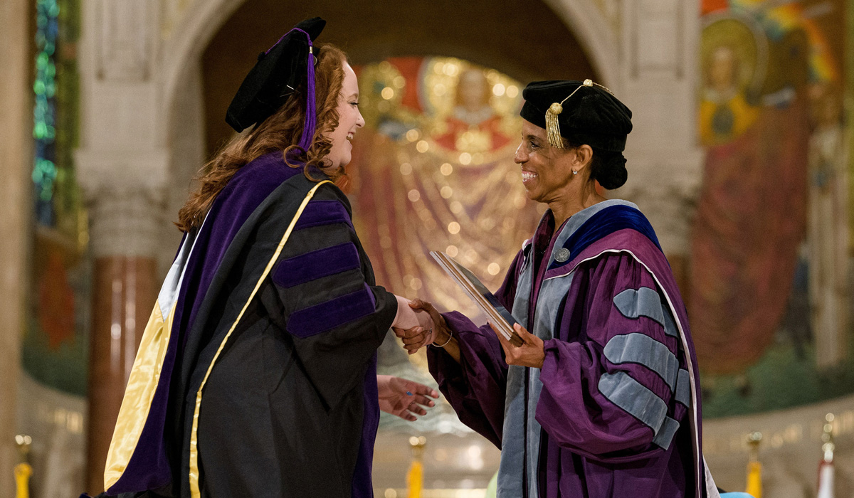 student receiving an award at commencement