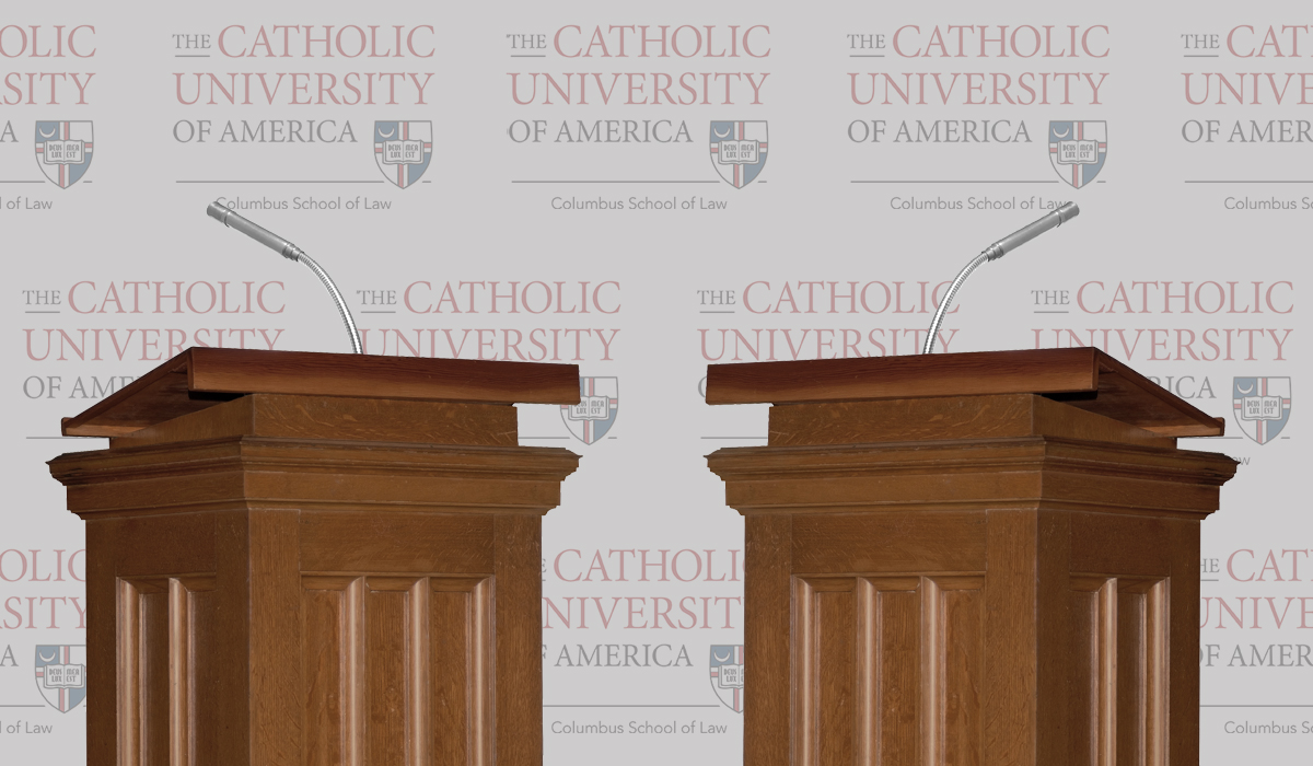 two podiums with Catholic Law logo in background
