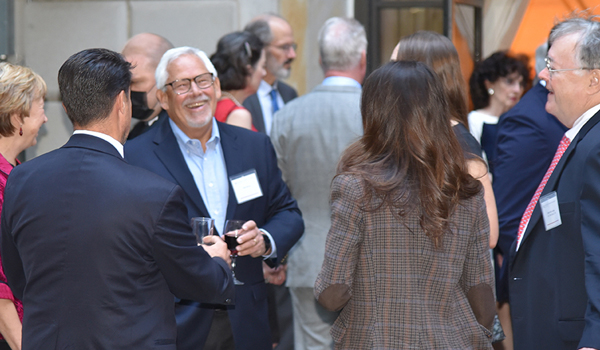 Alumni talking at Dean's Dinner Reception