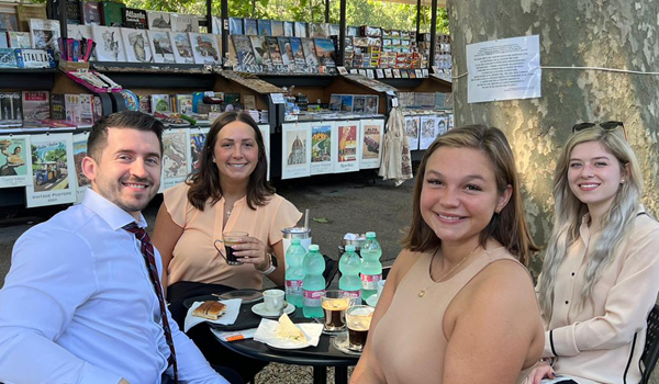 law students at a cafe table in Italy
