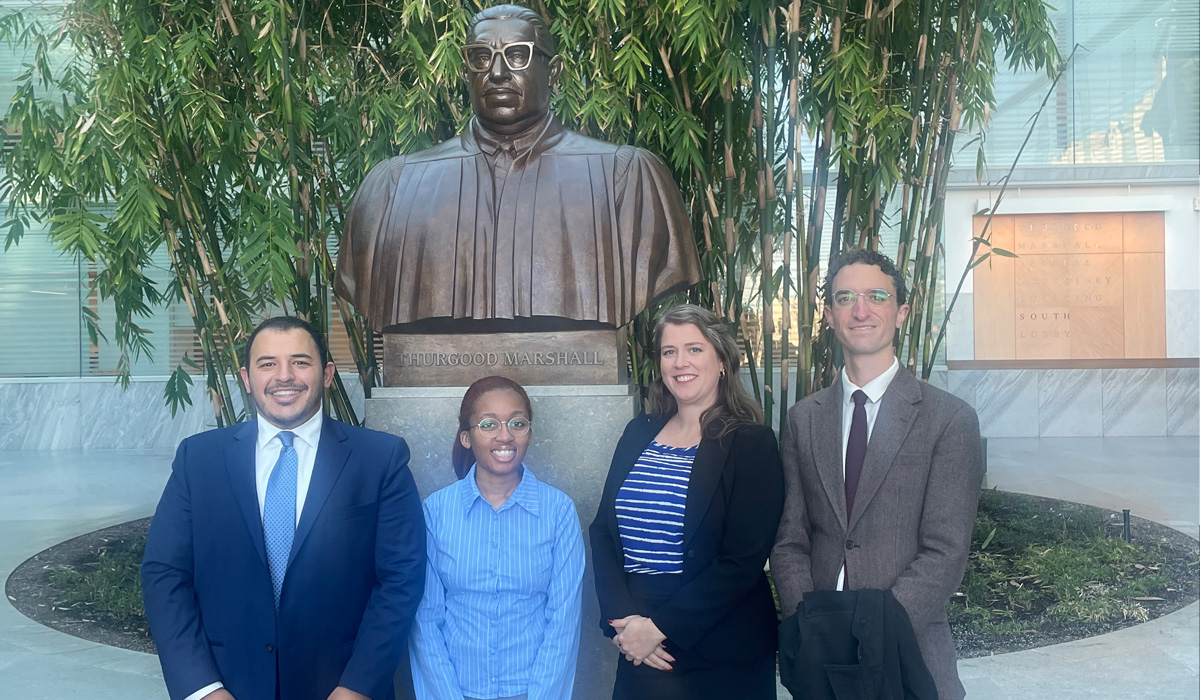 Four Catholic Law students at Thurgood Marshall Building