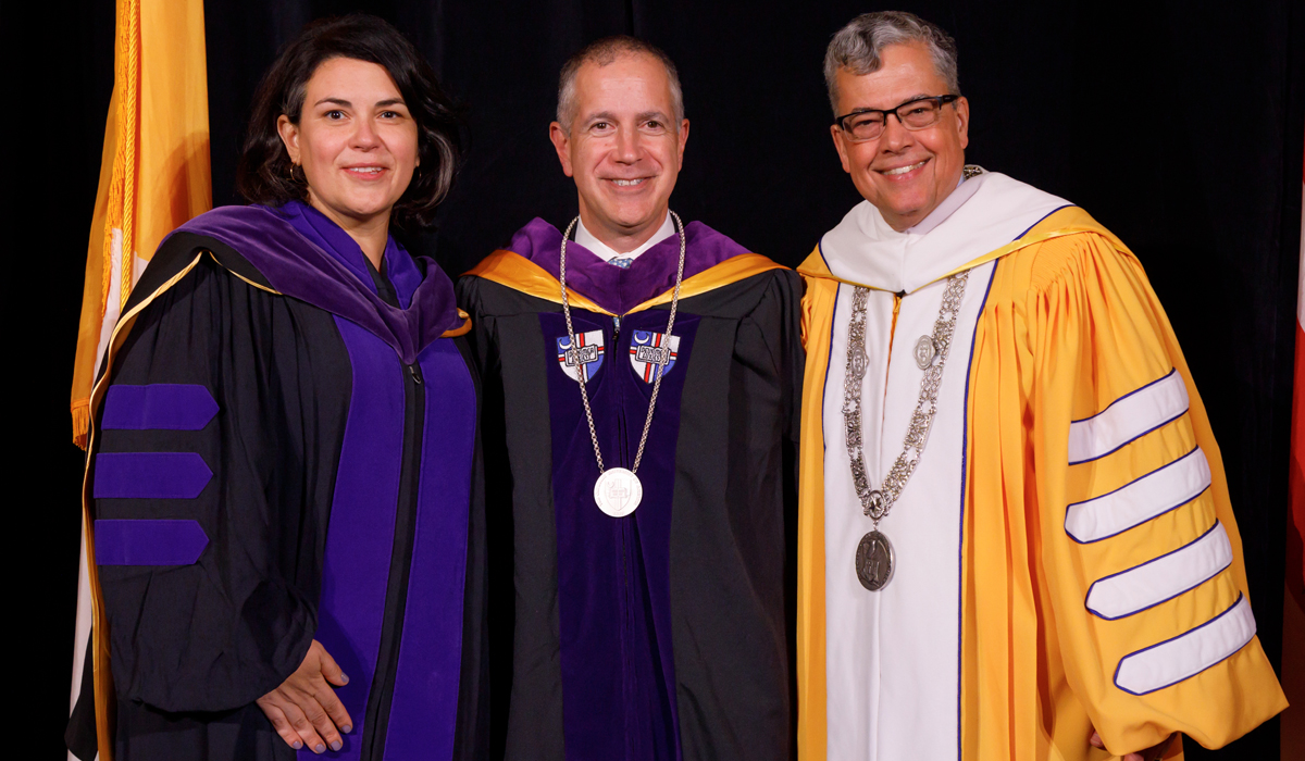 Katie Crowley, associate dean for administration and chief of staff at the Columbus School of Law; Marc DeGirolami; and University President Peter Kilpatrick at the installation.