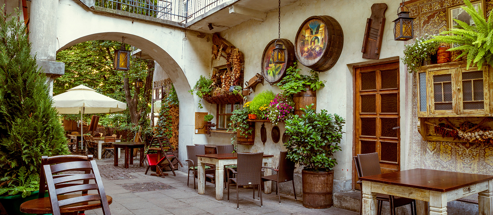 scenic photo of town square with birds and people