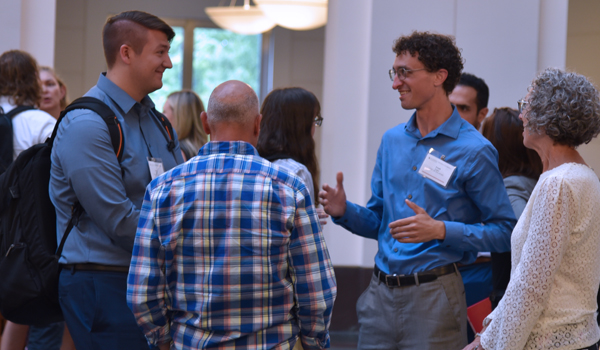 Students at induction ceremony reception