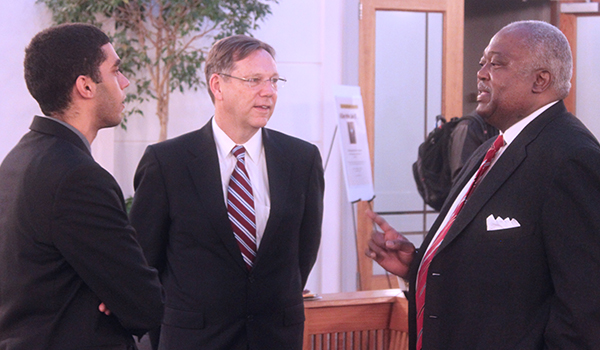 Judge Newman talking to a student and the Dean