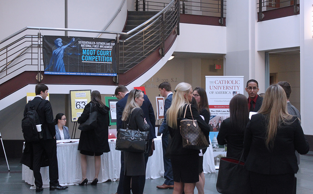 competitors registering for the Sutherland cup in the law school atrium