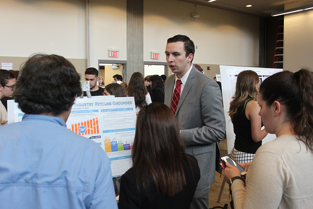 student speaking at CUA Research day