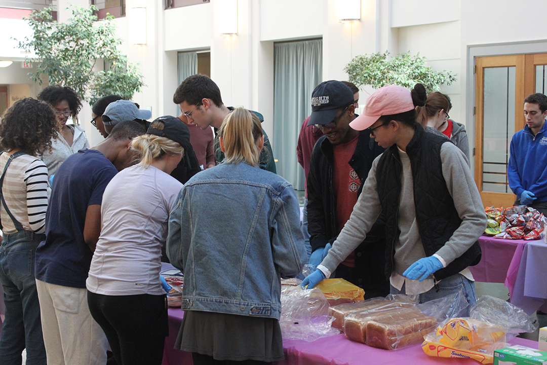students assembling lunches