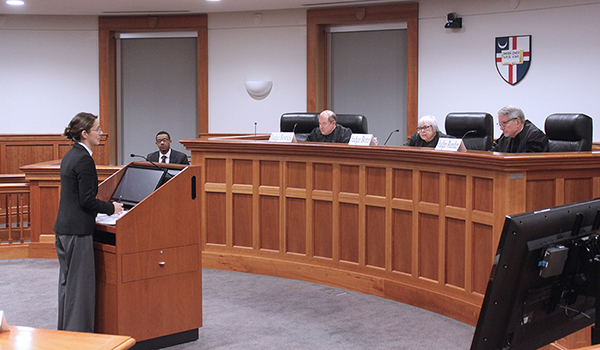 Christina Pashaj arguing before judges at the Ellen A. (Nell) Hennessy Employee Benefits Moot Court Competition